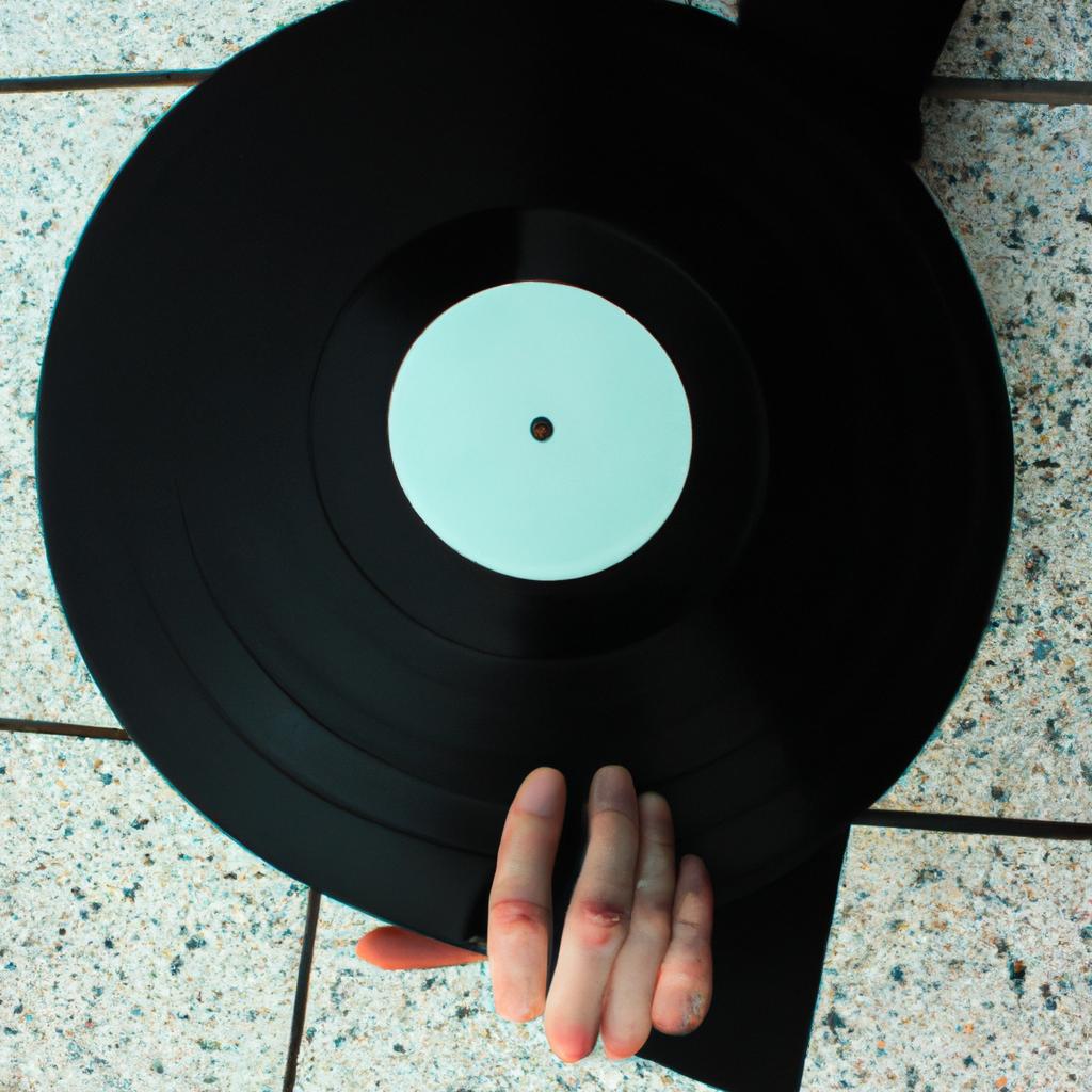 Person holding a vinyl record